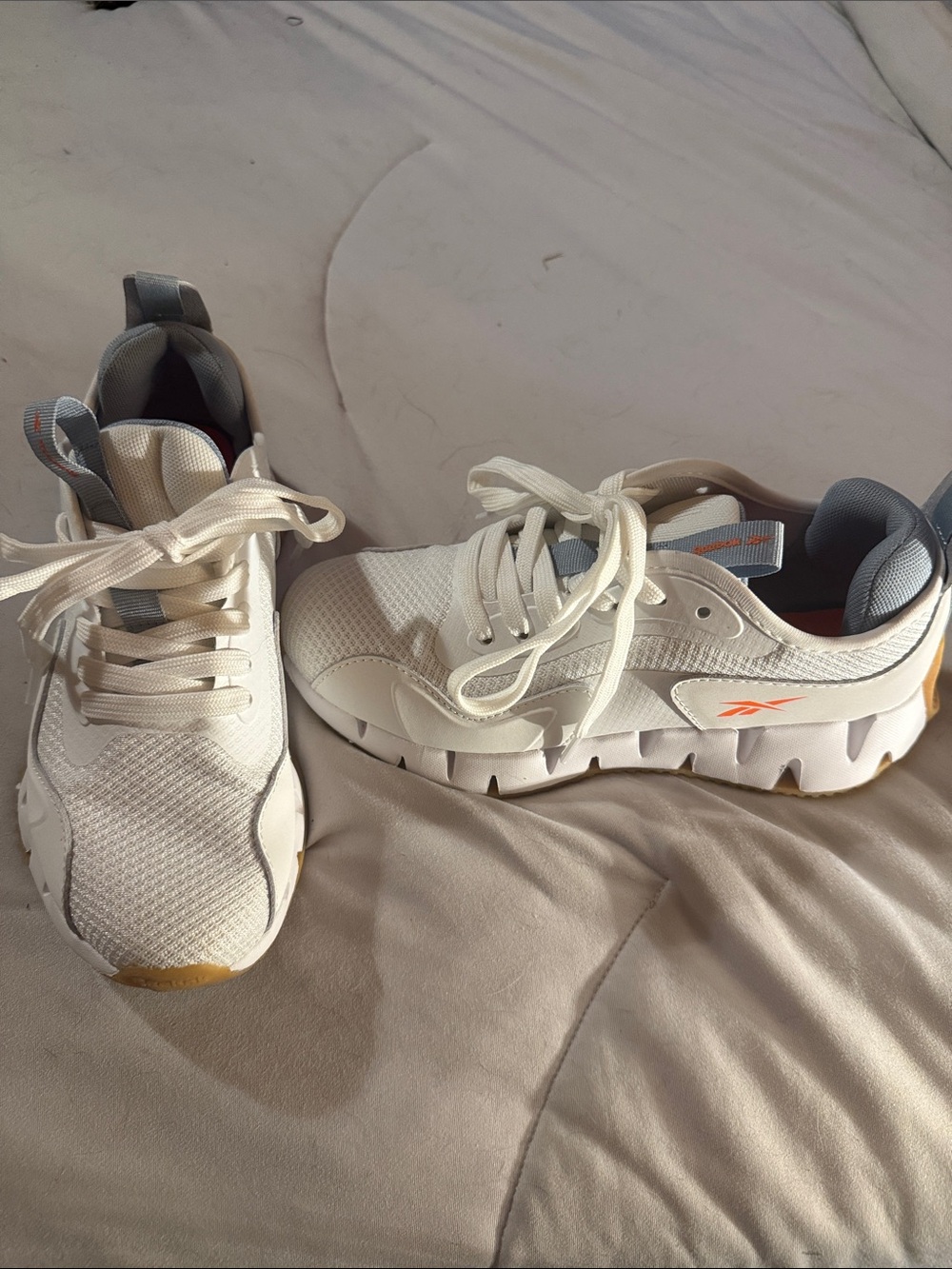Reebok Zip Dynamica White Sneakers with Orange Logo Detail